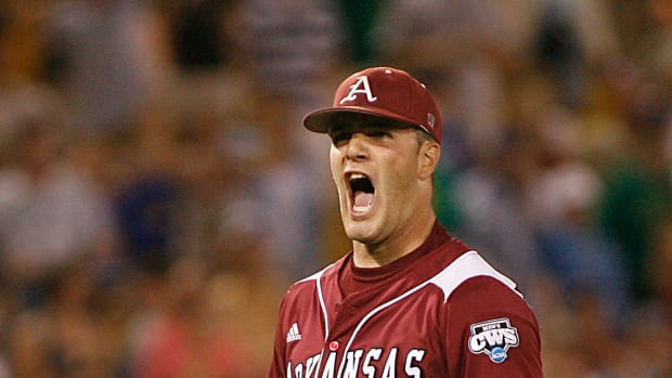 Arkansas Razorbacks pitcher Dallas Keuchel (29) reacts to the last out of the 12th inning against the Virginia Cavaliers during game nine of the College World Series at Rosenblatt Stadium. Arkansas defeated Virgina 4-3.
